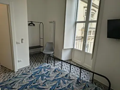 Letto o letti in una camera di Domus Archivii