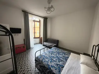 Letto o letti in una camera di Domus Archivii