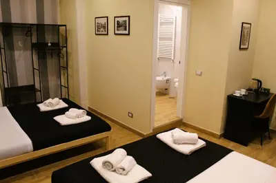 Letto o letti in una camera di BlackWoody Contemporary Rooms - Napoli Centro Storico Via Toledo