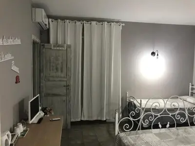 Letto o letti in una camera di La Peonia