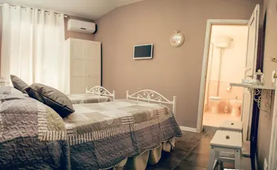 Letto o letti in una camera di La Peonia