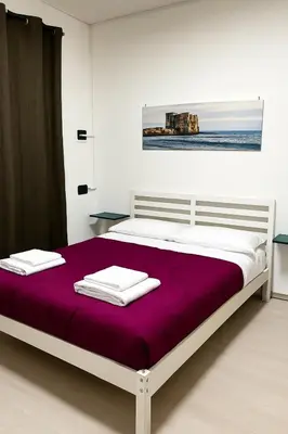 Letto o letti in una camera di House Piazza Plebiscito by Loveinthetravel
