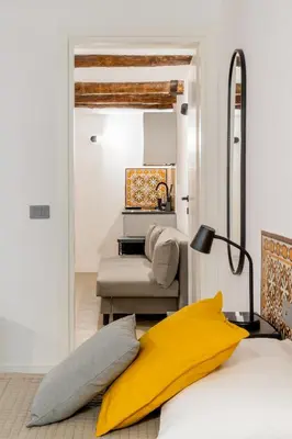 Letto o letti in una camera di Tra i vicoli di Napoli, La Olivella design e amore