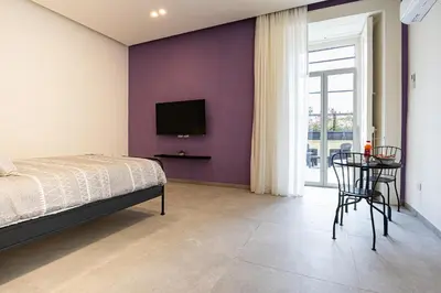 Letto o letti in una camera di Alyde Apartments