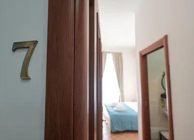 Letto o letti in una camera di Nel cuore di Napoli