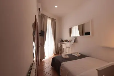 Letto o letti in una camera di Nel cuore di Napoli