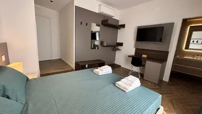 Letto o letti in una camera di Seaside Suites