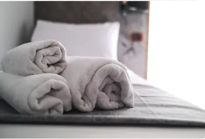 Letto o letti in una camera di Peppe triple rooms Napoli centro