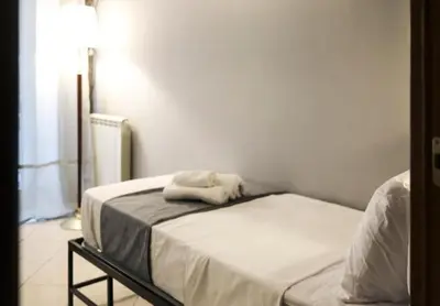 Letto o letti in una camera di Peppe triple rooms Napoli centro