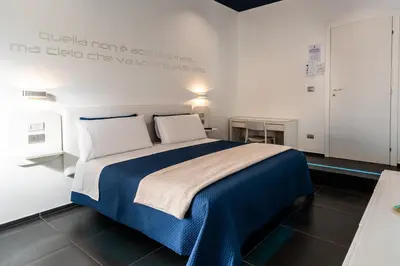 Letto o letti in una camera di Skyhouse Beverello