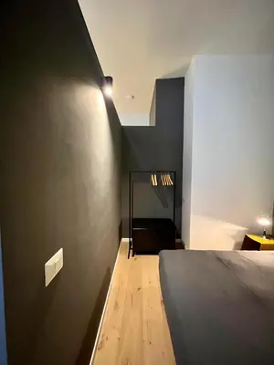 Letto o letti in una camera di Concrete Apartment Museo