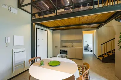 Cucina o angolo cottura di La Pinacoteca Aparthotel by NapoliApartments