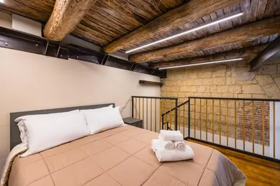 Letto o letti in una camera di La Pinacoteca Aparthotel by NapoliApartments
