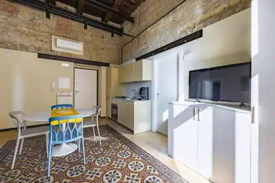 Cucina o angolo cottura di La Pinacoteca Aparthotel by NapoliApartments