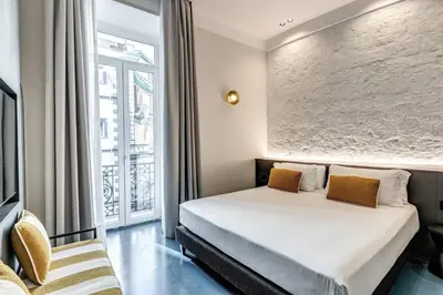 Letto o letti in una camera di Adaram Suites