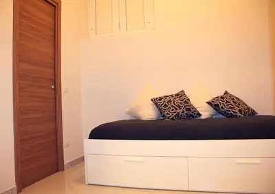 Letto o letti in una camera di Giuma House