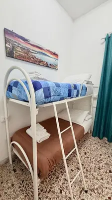Letto o letti in una camera di House Corso Umberto Rooms & Comfort by Loveinthetravel