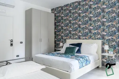 Letto o letti in una camera di HOTIDAY Room Collection - Napoli Centro Storico