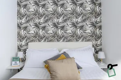 Letto o letti in una camera di HOTIDAY Room Collection - Napoli Centro Storico