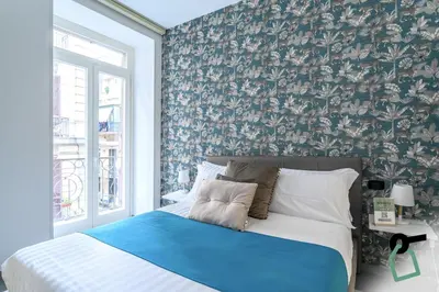 Letto o letti in una camera di HOTIDAY Room Collection - Napoli Centro Storico
