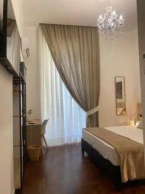 Letto o letti in una camera di AR b&b Nel Cuore di Napoli