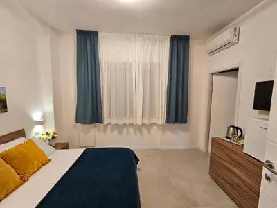 Letto o letti in una camera di Erminia Suite