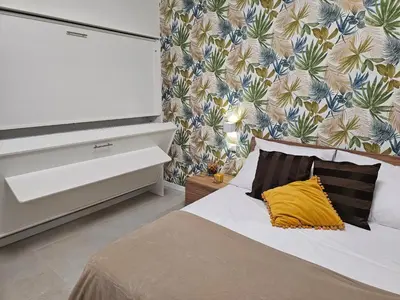 Letto o letti in una camera di Erminia Suite