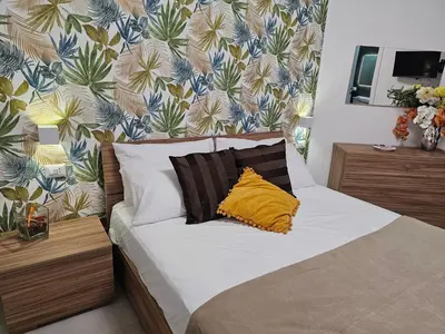 Letto o letti in una camera di Erminia Suite