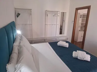 Letto o letti in una camera di Neapolis Apartment Angioino