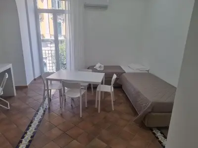 Area soggiorno di Neapolis Apartment Angioino