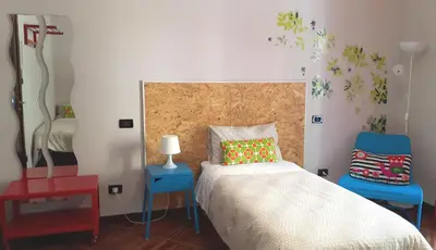 Letto o letti in una camera di Your Bed Napoli