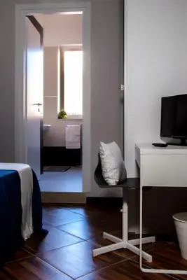 Letto o letti in una camera di Your Bed Napoli