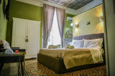Letto o letti in una camera di Le suite Vomero
