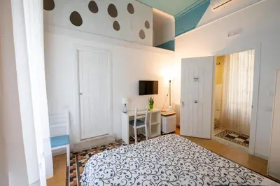 Letto o letti in una camera di Resta Cu'mme Vomero