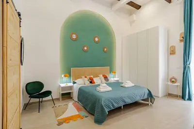 Letto o letti in una camera di Casa FeFe Napoli