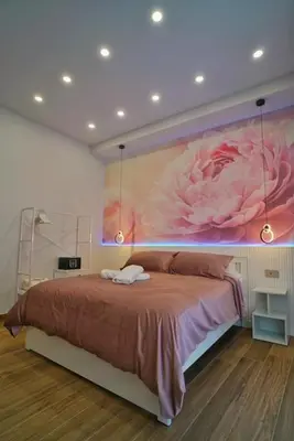 Letto o letti in una camera di Peonia Rooms