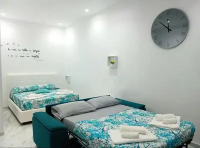 Letto o letti in una camera di Casa Naples
