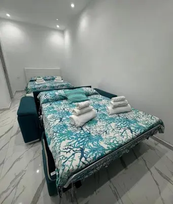 Letto o letti in una camera di Casa Naples