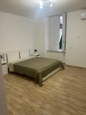 Letto o letti in una camera di suite di Peppe Napoli Centro