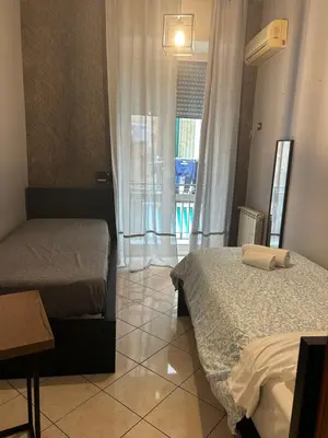 Letto o letti in una camera di suite di Peppe Napoli Centro