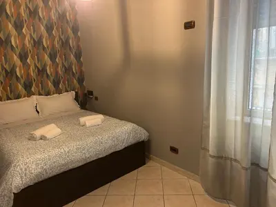 Letto o letti in una camera di suite di Peppe Napoli Centro