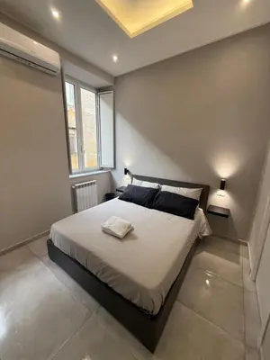 Letto o letti in una camera di La Casita Napoli Rooms