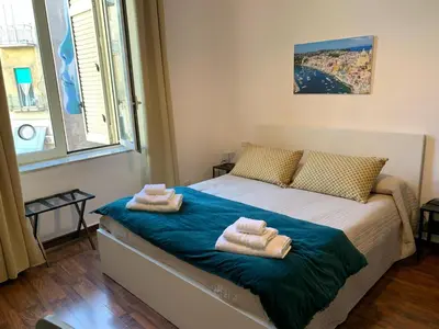 Letto o letti in una camera di La finestra su Napoli