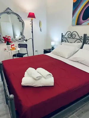 Letto o letti in una camera di Home Cuore di Napoli 5