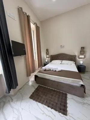 Letto o letti in una camera di Valentino suites&terrace