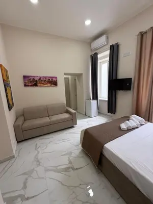 Letto o letti in una camera di Valentino suites&terrace