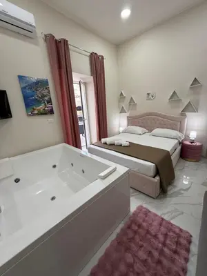Letto o letti in una camera di Valentino suites&terrace