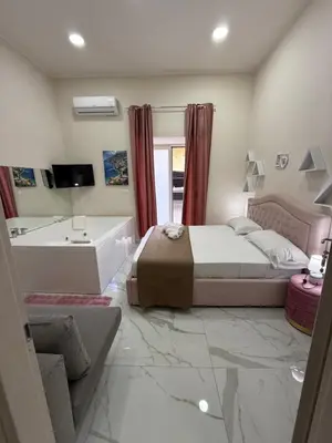 Letto o letti in una camera di Valentino suites&terrace