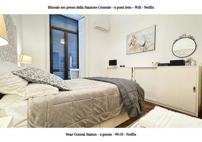 Letto o letti in una camera di STAZIONE CENTRALE - 4 posti letto con wifi e netflix a Piazza Garibaldi