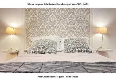 Letto o letti in una camera di STAZIONE CENTRALE - 4 posti letto con wifi e netflix a Piazza Garibaldi
